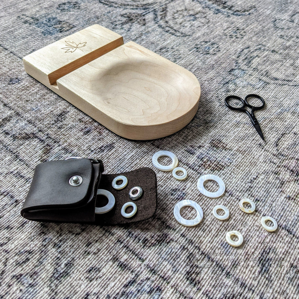 maple wood phone stand with mini scissors and leather case for seashell stitch markers