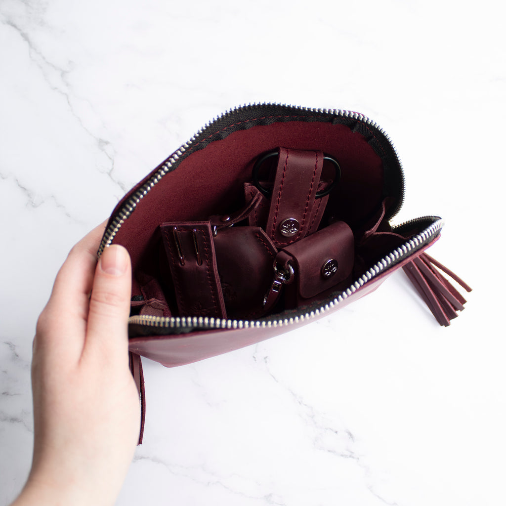 https://www.threadandmaple.com/cdn/shop/files/leather-notions-zip-wine-inside_1024x.jpg?v=1702092171