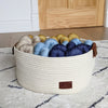 yarn storage basket made from cotton rope with brown leather handles