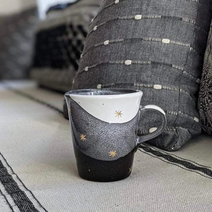 handmade wheel-thrown ceramic mug black with gold stars