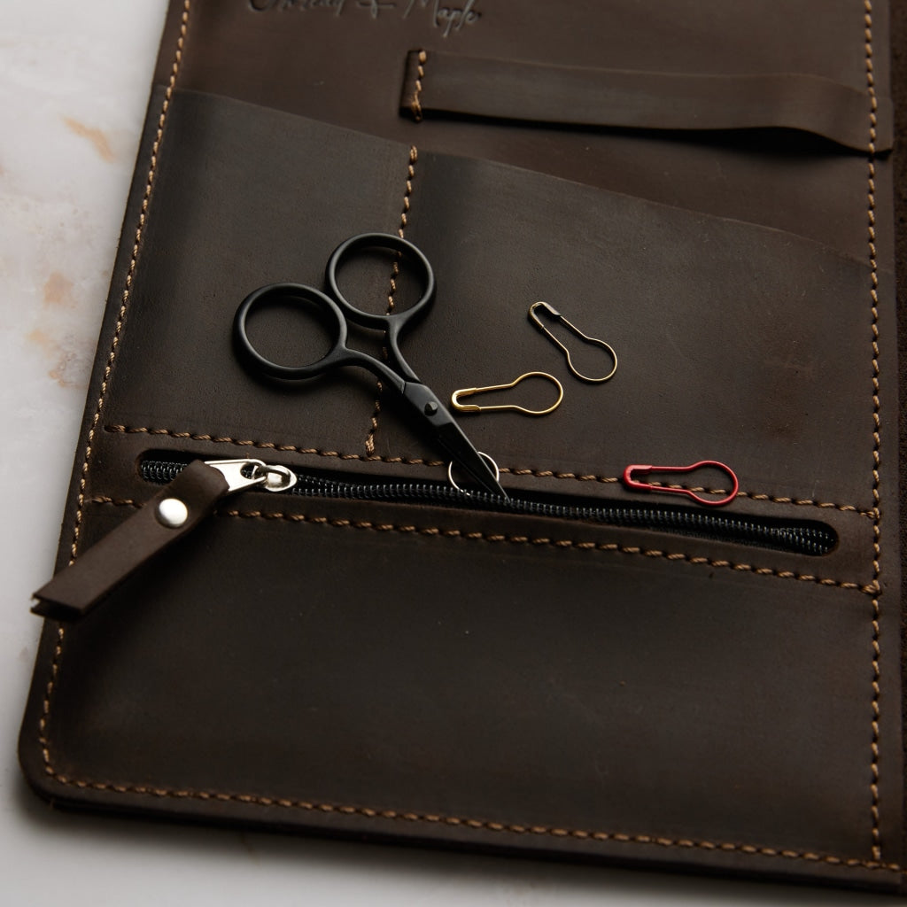 black mini scissors in brown leather folio zipper pocket