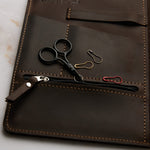 black mini scissors in brown leather folio zipper pocket